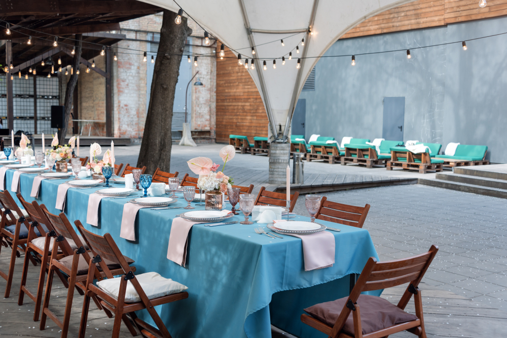 Industrial-chic event patio with string lights